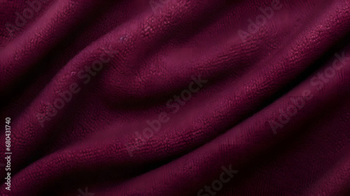 Intricate fibers in rich textured burgundy wool fabric