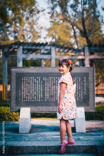 cute little asian girl in chinese traditional dress smiling