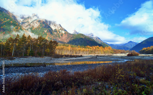 Kamikochi National Park in the Northern Japan Alps of Nagano Prefecture, Japan. Beautiful mountain in autumn leaf and Azusa river