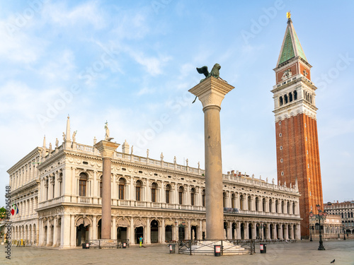 Marciana Library on St Mark's Square with Campanile and lion column photo