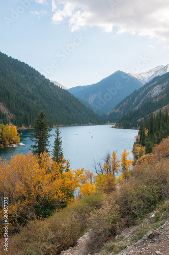 Autumn view of lake Kolsai or Kolsay located in the mountains of Kazakhstan  vertical shot