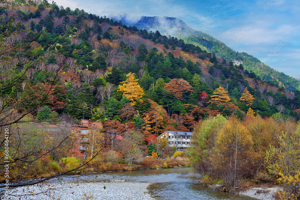 Fototapeta premium Kamikochi National Park in the Northern Japan Alps of Nagano Prefecture, Japan. Beautiful mountain in autumn leaf and Azusa river