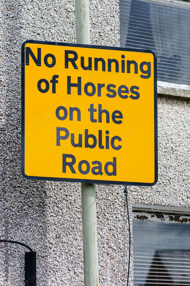 AA Street sign prohibiting the running of horses on the public road AA Street sign prohibiting the running of horses on the public road