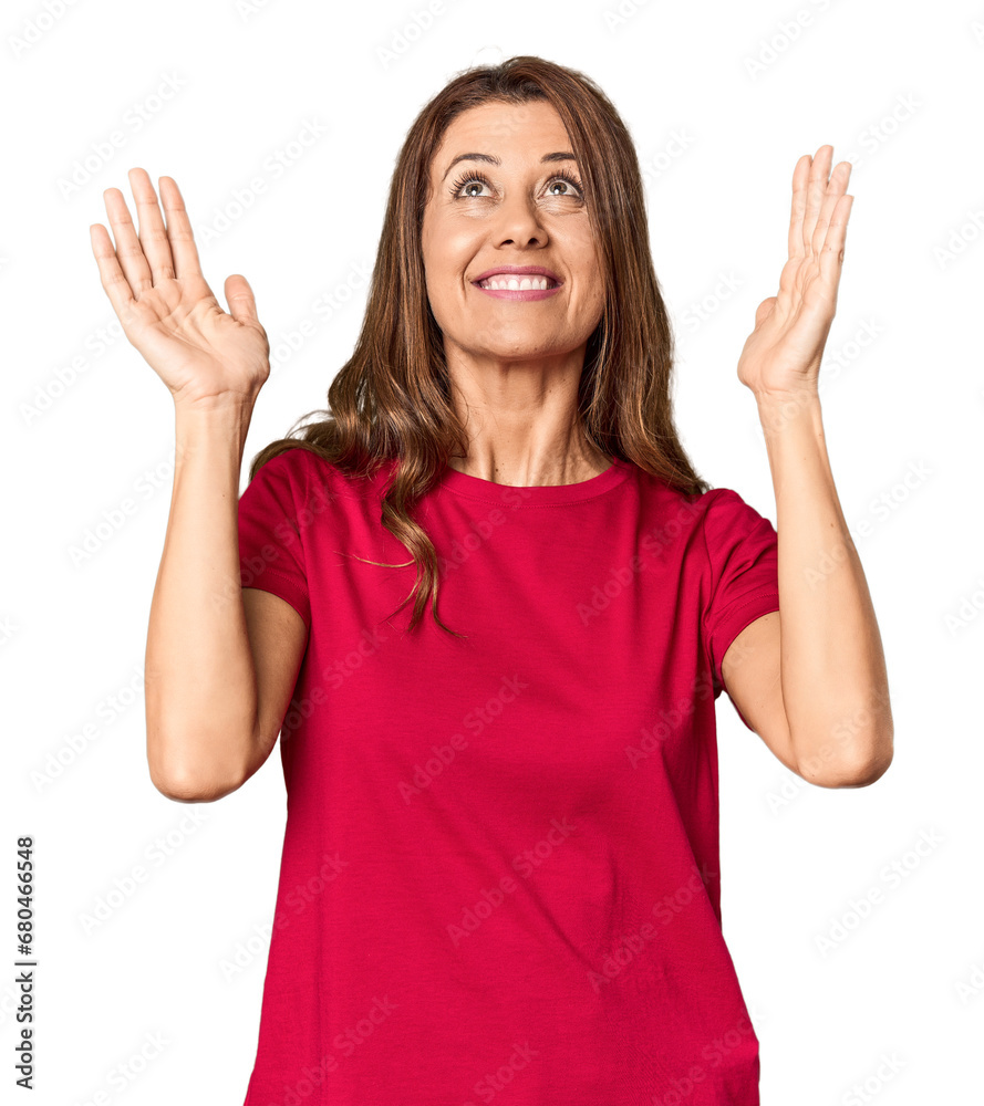 Middle-aged woman portrait in studio setting joyful laughing a lot. Happiness concept. Middle-aged woman portrait in studio setting joyful laughing a lot. Happiness concept.