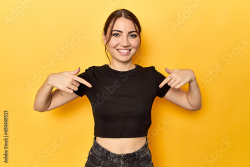 surprised pointing with finger, smiling broadly.