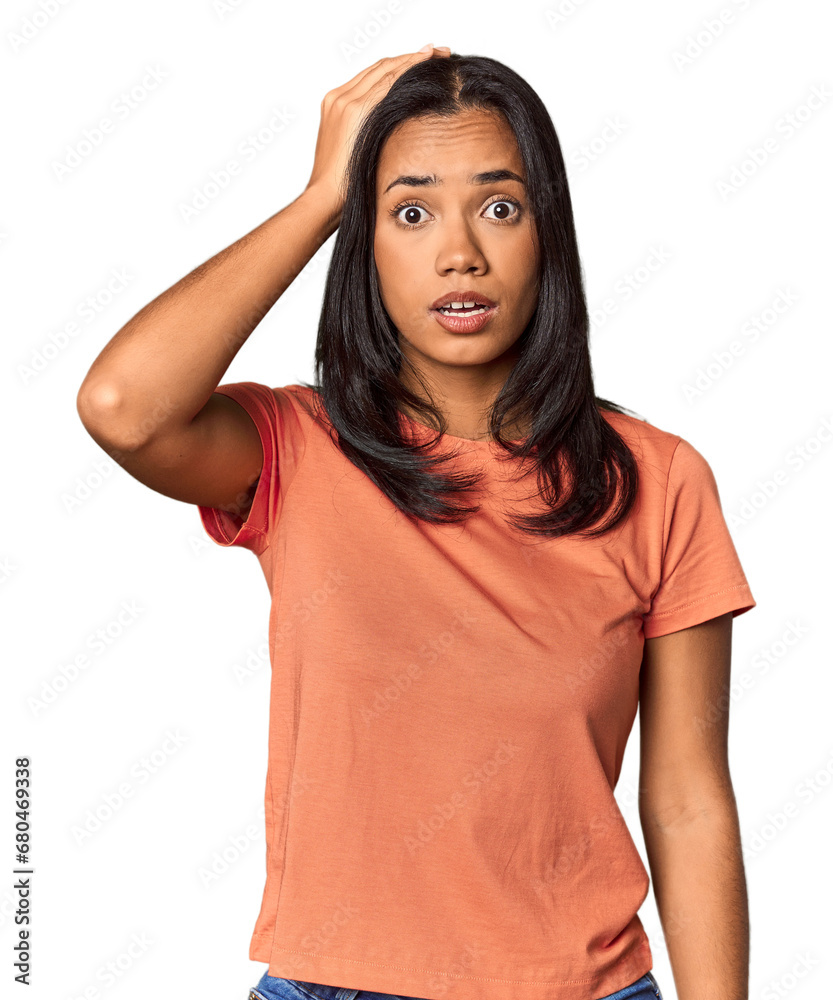 Young Filipina with long black hair in studio being shocked, she has remembered important meeting. Young Filipina with long black hair in studio being shocked, she has remembered important meeting.