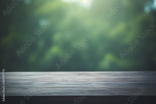 a dark wooden table top with a blurred green forest background and cold light flare.