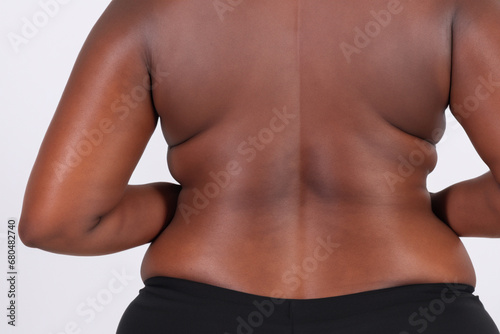 fat woman. overweight adult woman, view from the back, white background. fight against obesity concept