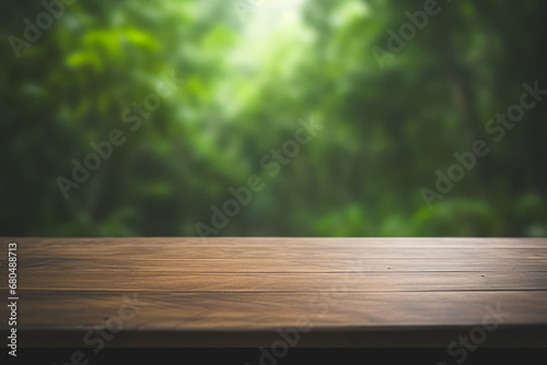 a wooden table top with a blurred green rain forest background