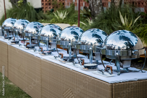 Stainless steel chafing dish at buffet line ready for catering wedding, business corporate, birthday, Sunday brunch or breakfast at a hotel photo