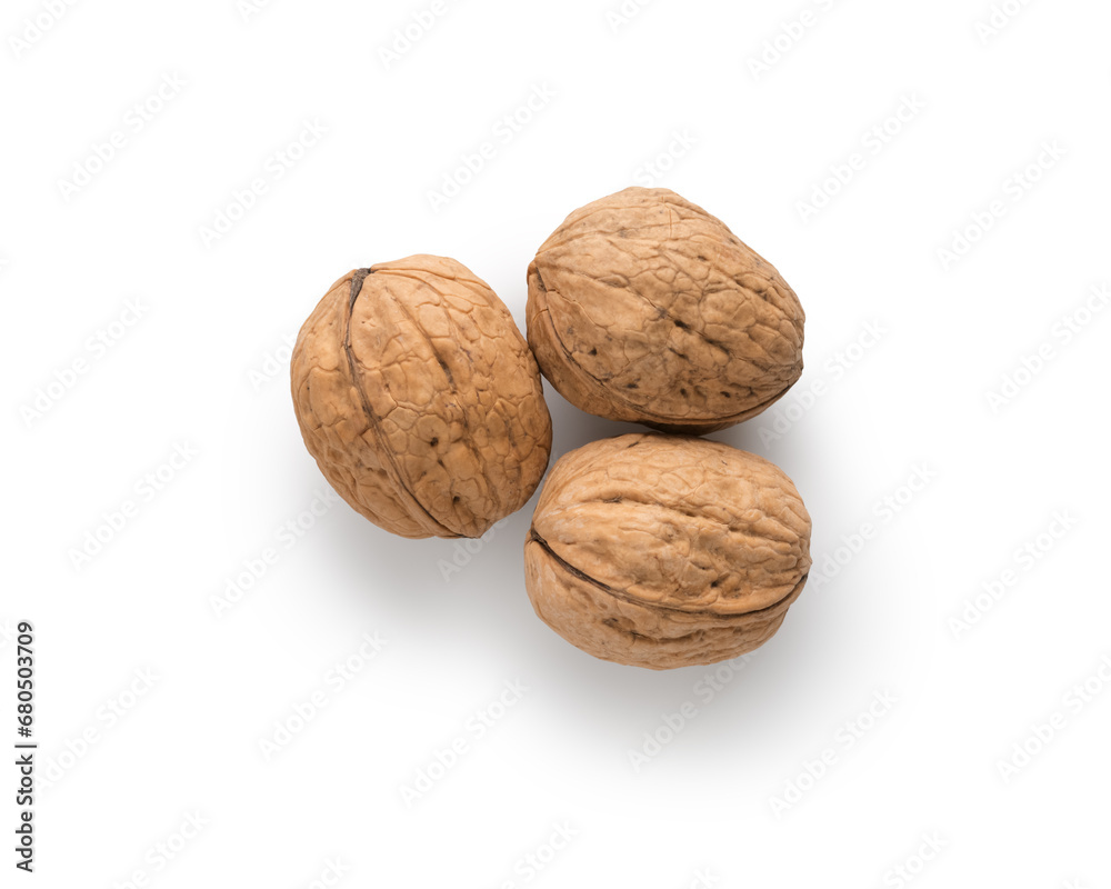 Three walnuts top view on white background Three walnuts top view on white background