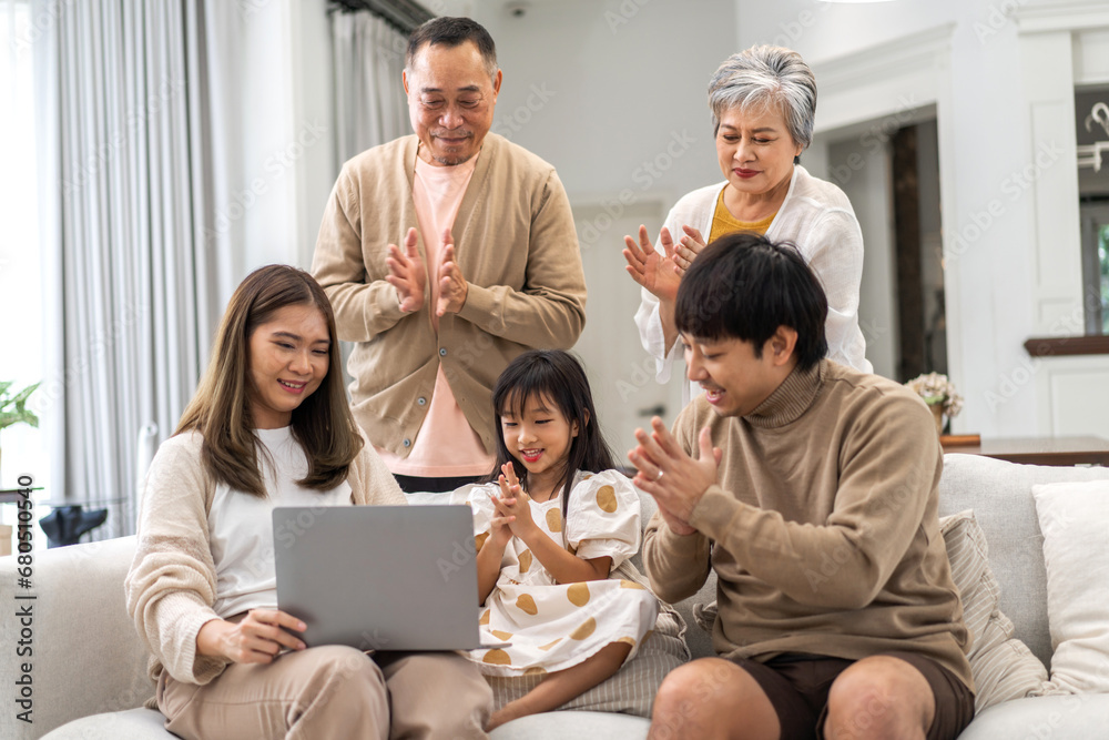 Father and mother with asian kid girl learn on laptop computer reviewing lesson study with online education e-learning.student look for educational knowledge in homeschool at home.Education Father and mother with asian kid girl learn on laptop computer reviewing lesson study with online education e-learning.student look for educational knowledge in homeschool at home.Education