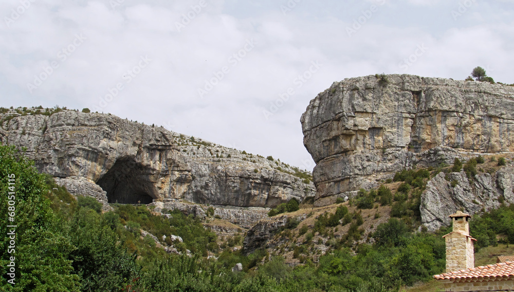 Panoramic view of the mountains and the cave of la Vega del Codorno.               