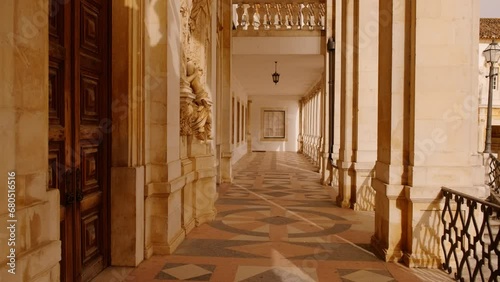 POV walk along the colonnade of the Faculty of Law in the Old University of Coimbra, Portugal, one of the oldest in the world, dating back to 1290