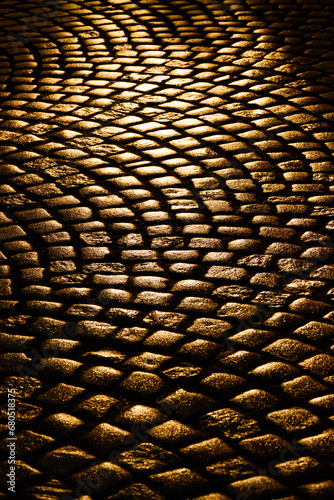 reflection of the sun in the paving stones of the street of Gdansk Poland