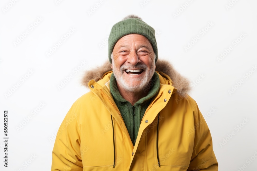Portrait of a joyful man in his 60s wearing a warm parka against a white background. AI Generation Portrait of a joyful man in his 60s wearing a warm parka against a white background. AI Generation