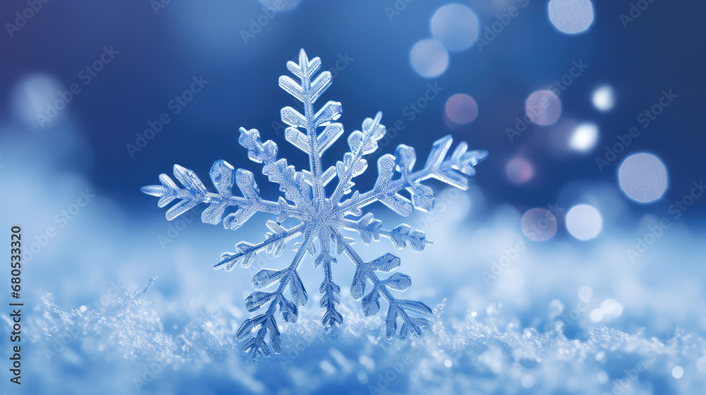 Winter wallpaper or background. Macro closeup of a beautifully patterned snowflake. Winter wallpaper or background. Macro closeup of a beautifully patterned snowflake.