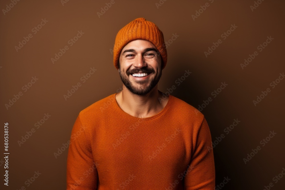 Portrait of a happy man in his 30s donning a warm wool beanie against a soft brown background. AI Generation Portrait of a happy man in his 30s donning a warm wool beanie against a soft brown background. AI Generation