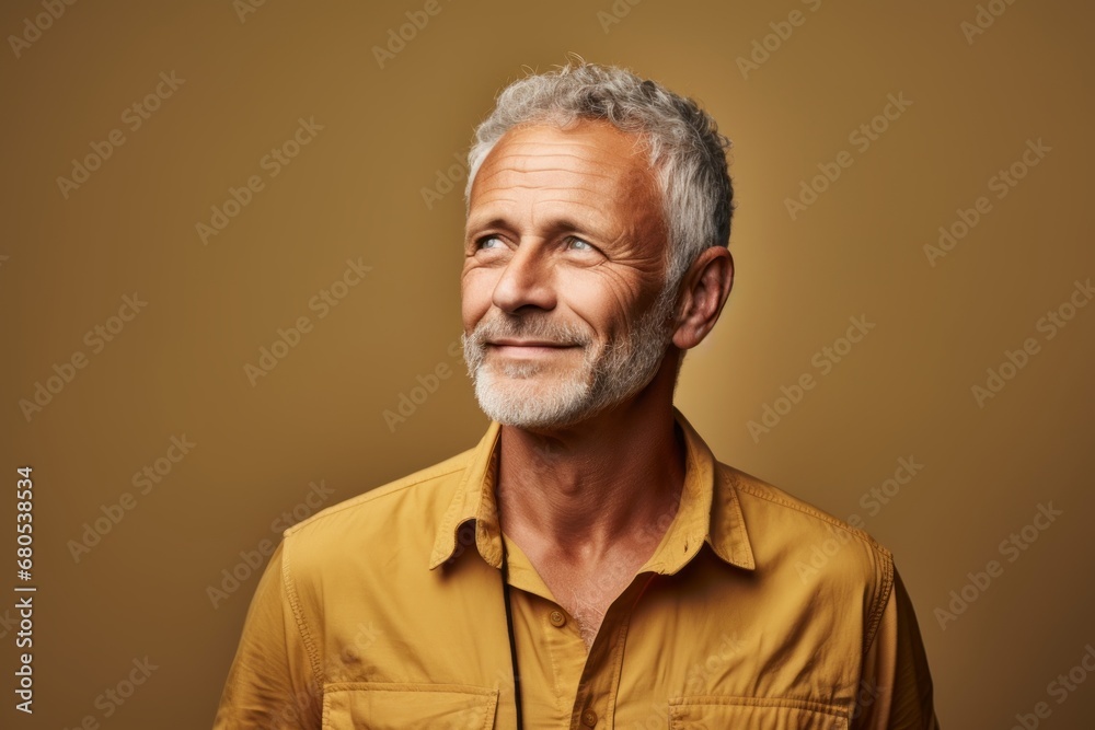 Portrait of a blissful man in his 50s sporting a breathable hiking shirt against a soft brown background. AI Generation Portrait of a blissful man in his 50s sporting a breathable hiking shirt against a soft brown background. AI Generation