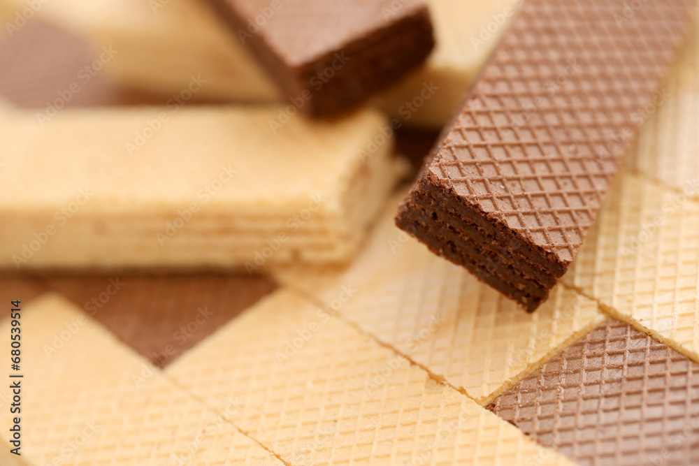 Stacked delicious chocolate wafers in large amount. Two different flavours of classic small waffles Stacked delicious chocolate wafers in large amount. Two different flavours of classic small waffles