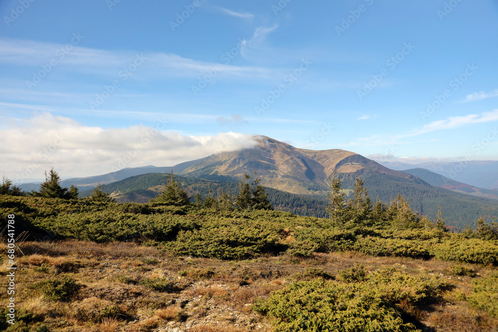 Landscape with Mount Hoverla hanging peak of the Ukrainian Carpathians against the background of the sky and clouds