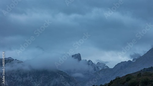 Naranjo de Bulnes Peak between clouds photo