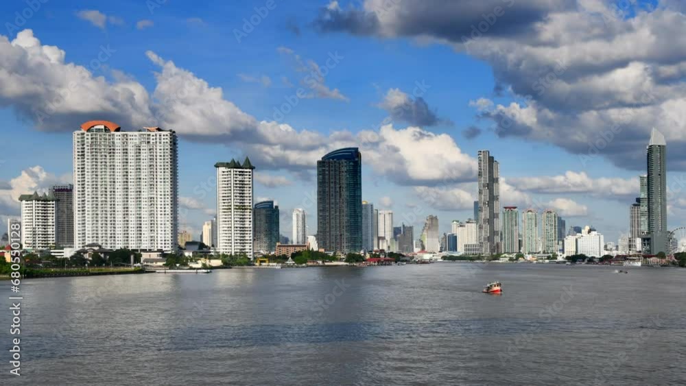 View of a building with a river in the foreground of the city of Bangkok. On a day when the sky is full of clouds, in the form of a 4K time-lapse video View of a building with a river in the foreground of the city of Bangkok. On a day when the sky is full of clouds, in the form of a 4K time-lapse video