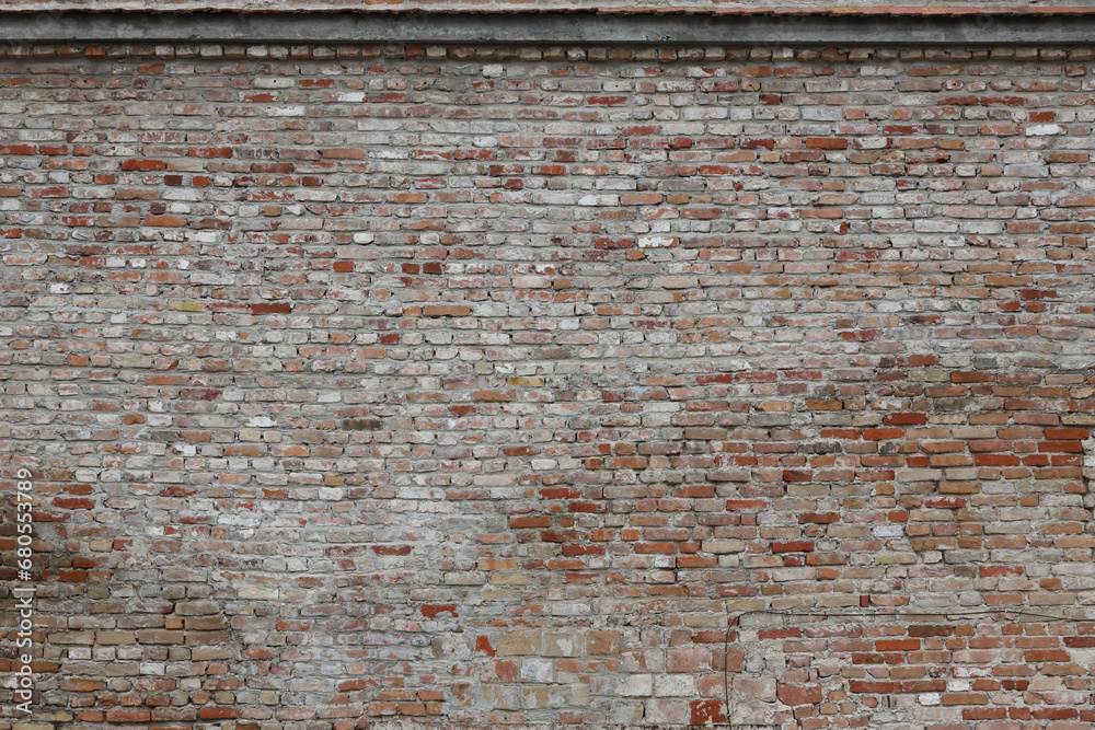 Very old brick stone wall of castle or fortress of 18th century. Full frame wall with obsolete dirty and cracked bricks close up Very old brick stone wall of castle or fortress of 18th century. Full frame wall with obsolete dirty and cracked bricks close up