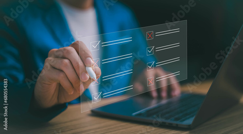 Checklist online questionnaire form concept, businessman tick option online survey, Customer Experiences research poll on website, answer questions of test, checkmarks and Filling online form. photo