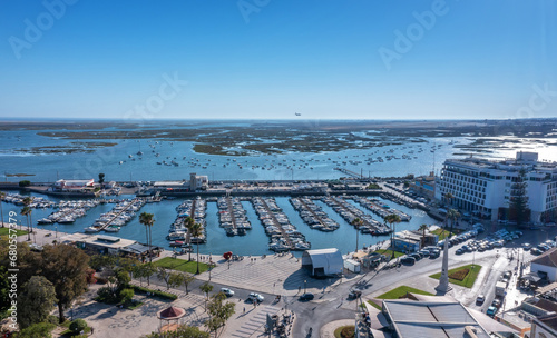 A stunning aerial cityscape of the city of Faro in Portugal view of the maritime tourist port marina.