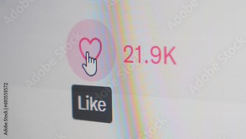 User clicking like button, close up of a computer screen view