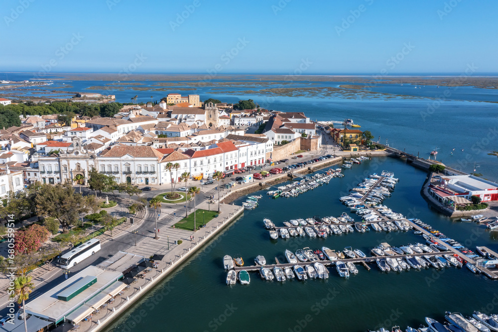Aerial view of the city of Faro in Portugal with a view of the seaside tourist port and the old town in the background.