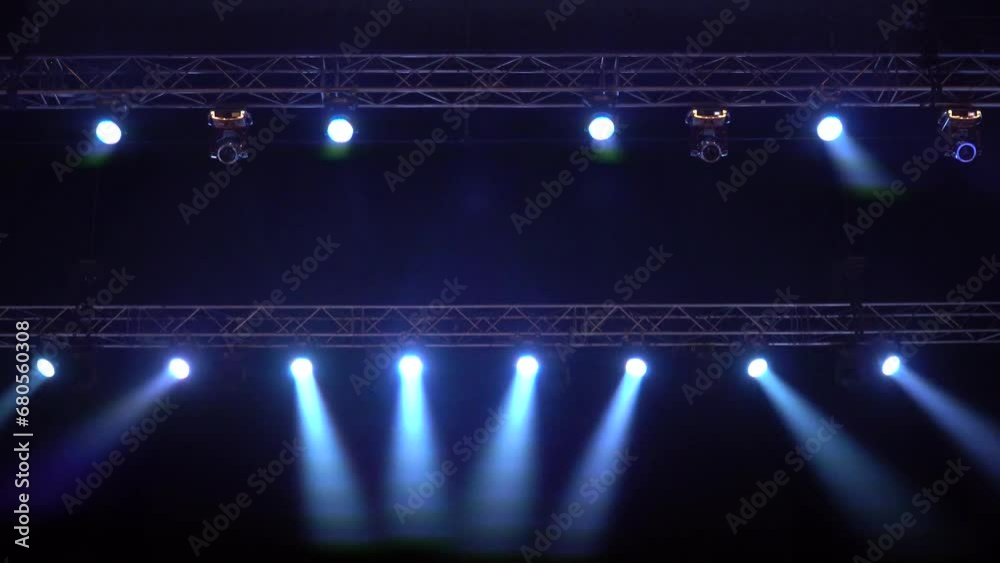 Strobe blue light from stage lighting equipment in a concert hall