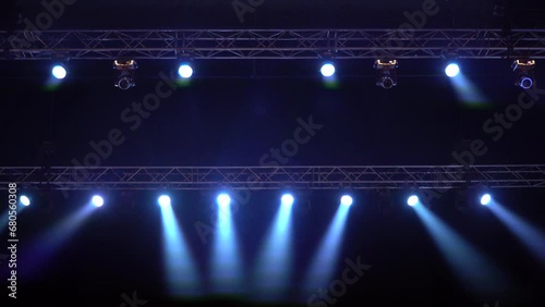 Strobe blue light from stage lighting equipment in a concert hall photo