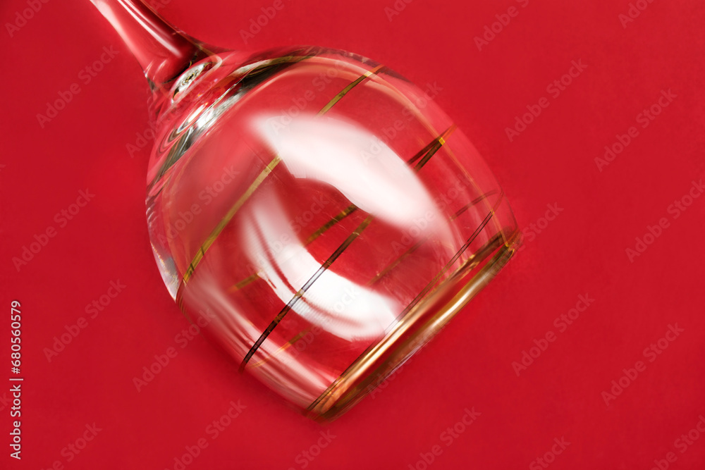 Wineglass on red background