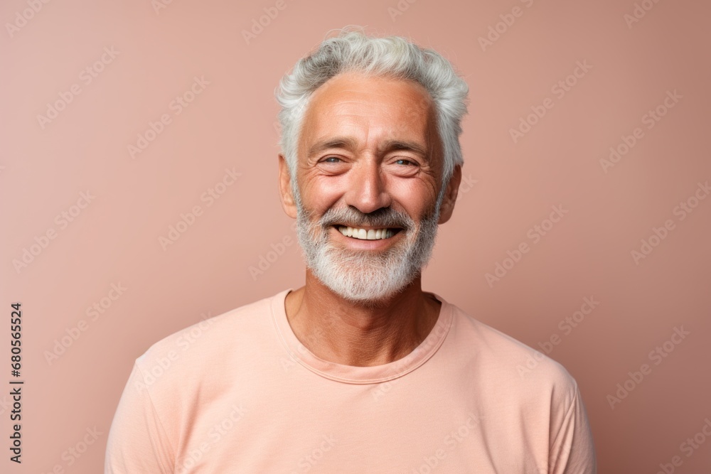 Portrait of a jovial man in his 60s wearing a simple cotton shirt against a solid pastel color wall. AI Generation Portrait of a jovial man in his 60s wearing a simple cotton shirt against a solid pastel color wall. AI Generation