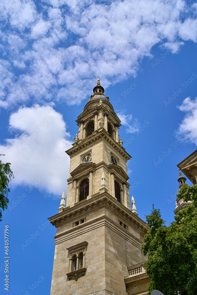 Close ups of the towers of St. Stephen's Basilica (Szent István Bazilika) among the trees in Budapest, Hungary.