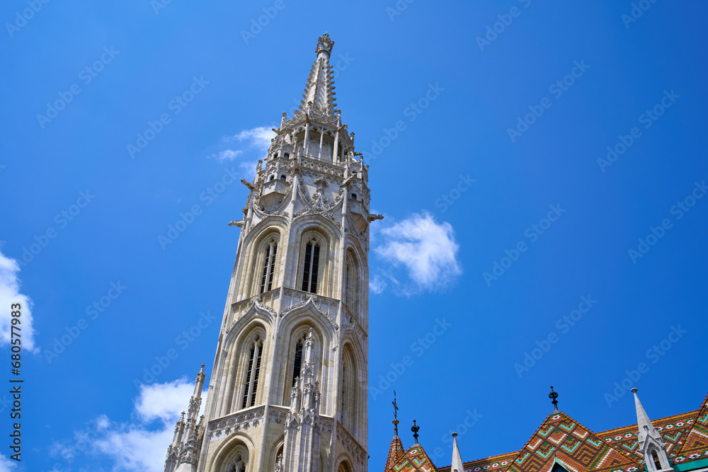 Close ups of the main tower and decorative roof of the 13th-century church Matthias Church in Budapest, Hungary. Close ups of the main tower and decorative roof of the 13th-century church Matthias Church in Budapest, Hungary.