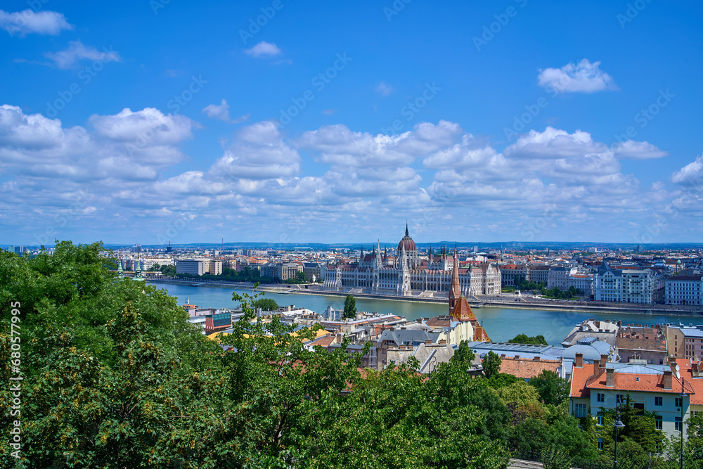 Hungarian parliament building as seen from the hills on a sunny summer day. Budapest, Hungary.