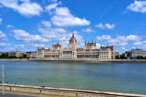 Hungarian Parliament Building on a summer day as seen from the opposing bank of the Danube river in central Budapest, Hungary.