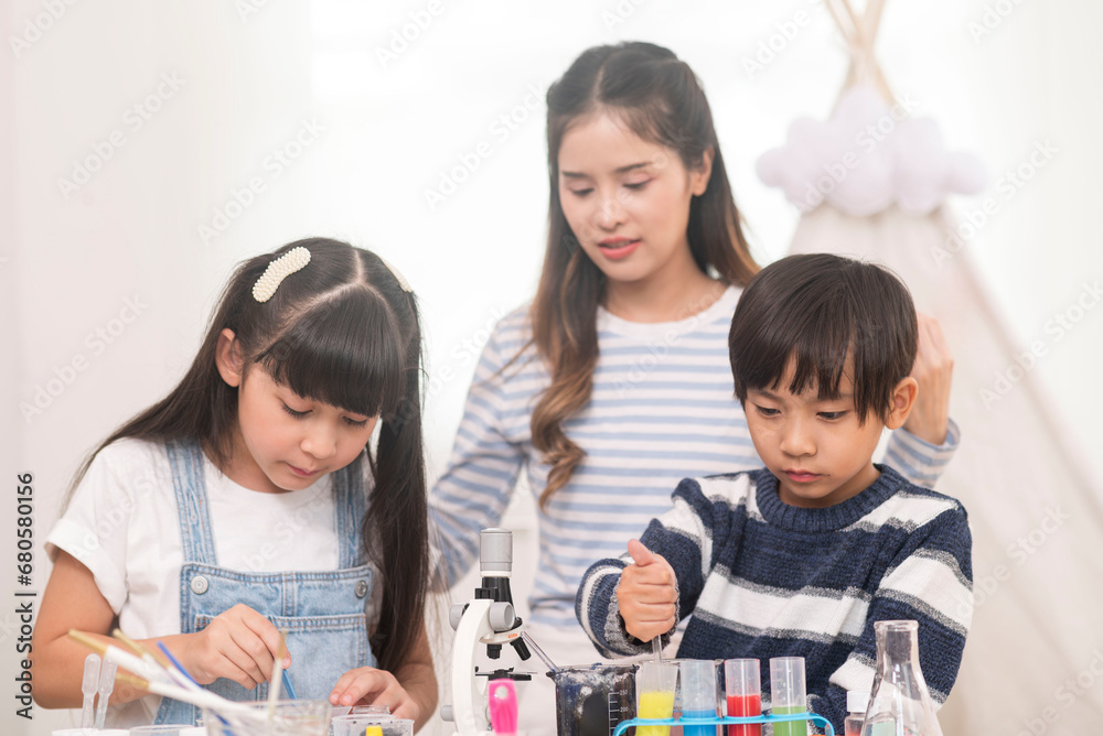young boy and girl learning test science at home school young boy and girl learning test science at home school