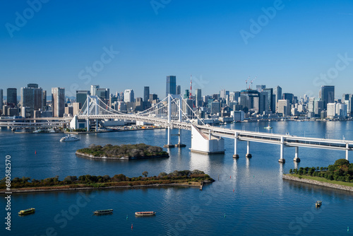 View of Tokyo Skyline and Tokyo Bay with Rainbow Bridge on  a clear blue sky day photo