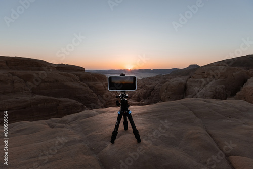 Smartphone on tripod in the desert shooting sunset Egypt photo