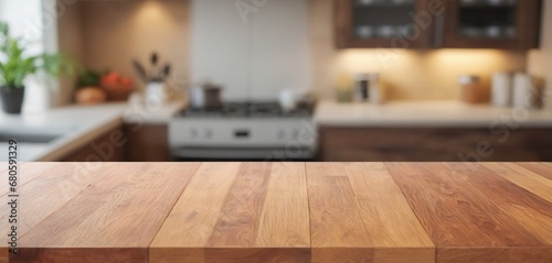 Wooden table on blurred kitchen bench background. Empty wooden table and blurred kitchen background for display or montage your products