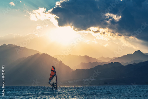 Wind-surfer on the water in Lagoon Dahab area at sunset, Sinai, EgyptWind-surfer on the water in Lagoon Dahab area at sunset, Sinai, Egypt © Natalia