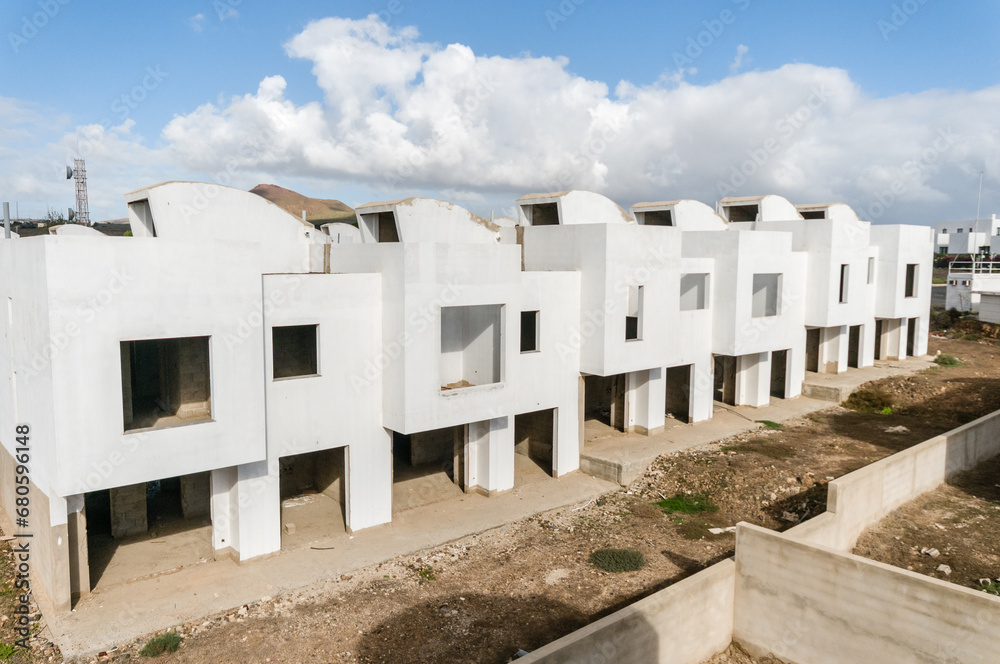 Half-finished apartments on an abandoned Spanish building site, closed down following recession and slump in financial market Half-finished apartments on an abandoned Spanish building site, closed down following recession and slump in financial market