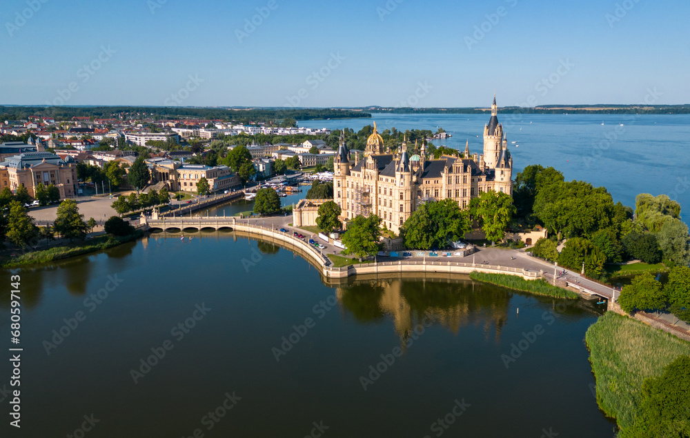 Aerial drone shot of the city of Schwerin and Schwerin Castle in northern Germany, surrounded by beautiful lakes