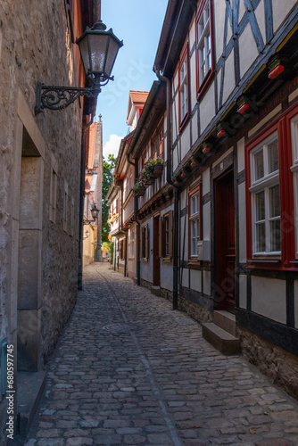 Timber-framed houses lining a narrow cobblestoned street in the Old Town of Erfurt, Germany © QuiBee