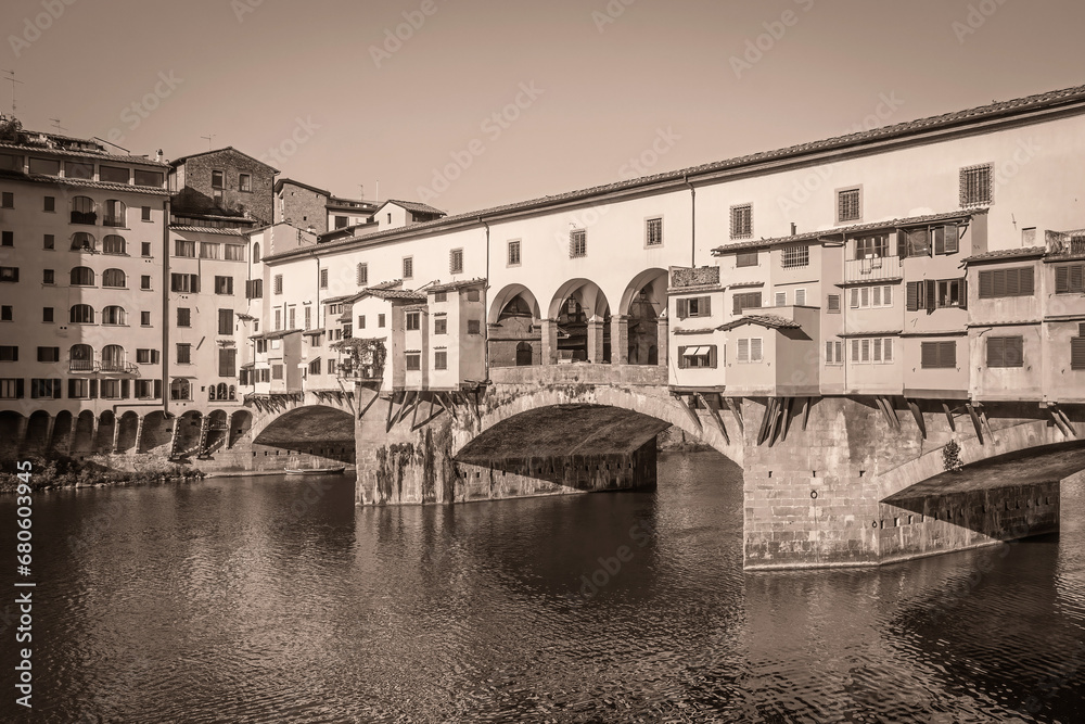Ponte Vecchio Bridge in (Florence, Tuscany, Italy). Edited as a vintage photo. Horizontally. 
