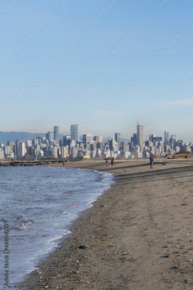 Fototapeta premium Beautiful view of the skyline of Vancouver in the distance as seen from Jericho Beach in Vancouver, British Columbia, Canada
